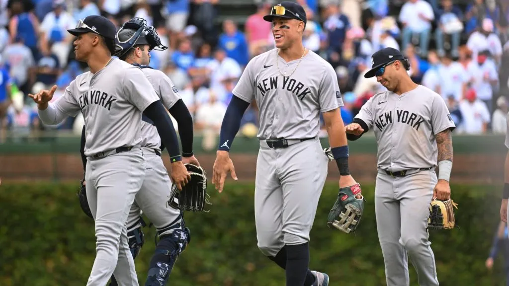 (L-R) Juan Soto #22 Austin Wells #28 Aaron Judge #99 and Gleyber Torres #25 of the New York Yankees celebrate after their team win over the Chicago Cubs at Wrigley Field on September 06, 2024 in Chicago, Illinois. (Photo by Nuccio DiNuzzo/Getty Images)