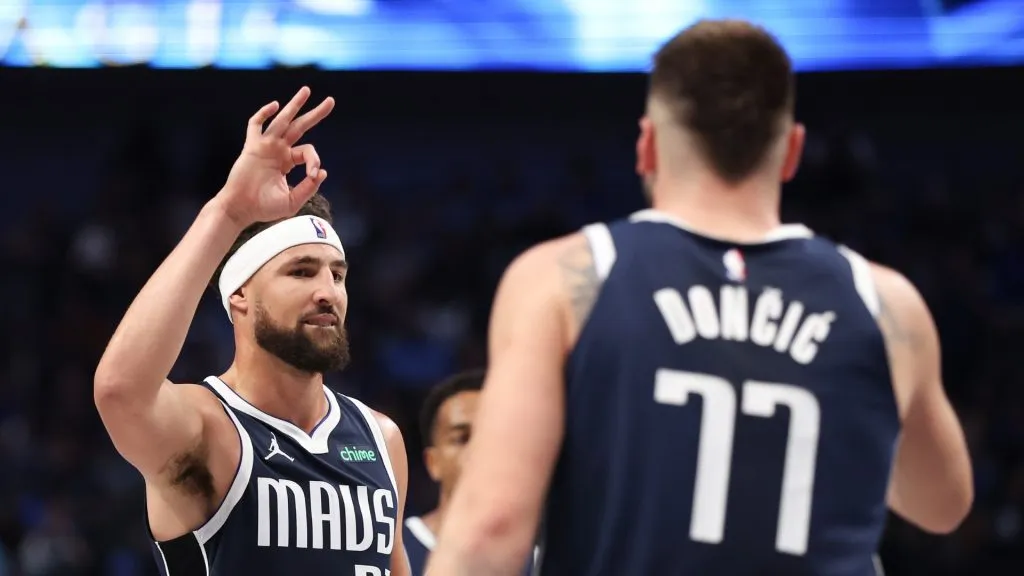 Klay Thompson #31 of the Dallas Mavericks congratulates Luka Doncic #77 on his three-point basket against the San Antonio Spurs during the third quarter at American Airlines Center on October 24, 2024 in Dallas, Texas.