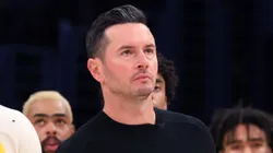 Bronny James #9 of the Los Angeles Lakers reacts with head coach JJ Redick during the second quarter against the Minnesota Timberwolves at Crypto.com Arena on October 22, 2024 in Los Angeles, California.