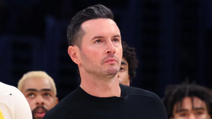 Bronny James #9 of the Los Angeles Lakers reacts with head coach JJ Redick during the second quarter against the Minnesota Timberwolves at Crypto.com Arena on October 22, 2024 in Los Angeles, California.