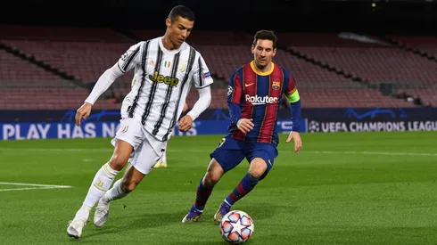 Cristiano Ronaldo of Juventus F.C. is put under pressure by Lionel Messi of Barcelona during the UEFA Champions League Group G stage match between FC Barcelona and Juventus.