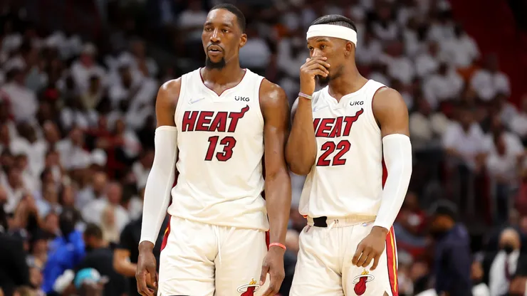 Bam Adebayo #13 and Jimmy Butler #22 of the Miami Heat talk during a game against the Boston Celtics on May 19, 2022.