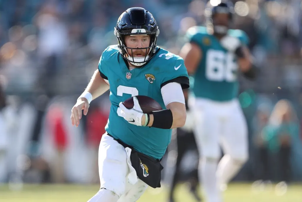 JACKSONVILLE, FLORIDA – DECEMBER 31: C.J. Beathard #3 of the Jacksonville Jaguars runs the ball during the third quarter against the Carolina Panthers at EverBank Stadium on December 31, 2023 in Jacksonville, Florida. (Photo by Courtney Culbreath/Getty Images)