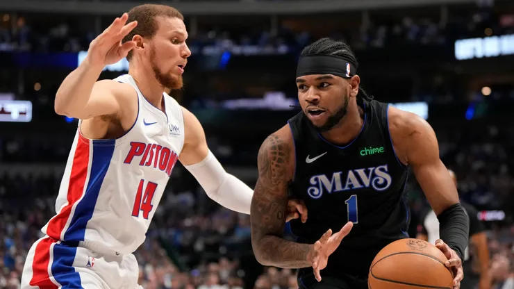 Jaden Hardy #1 of the Dallas Mavericks is defended by Malachi Flynn #14 of the Detroit Pistons during the first half at American Airlines Center on April 12, 2024 in Dallas, Texas.