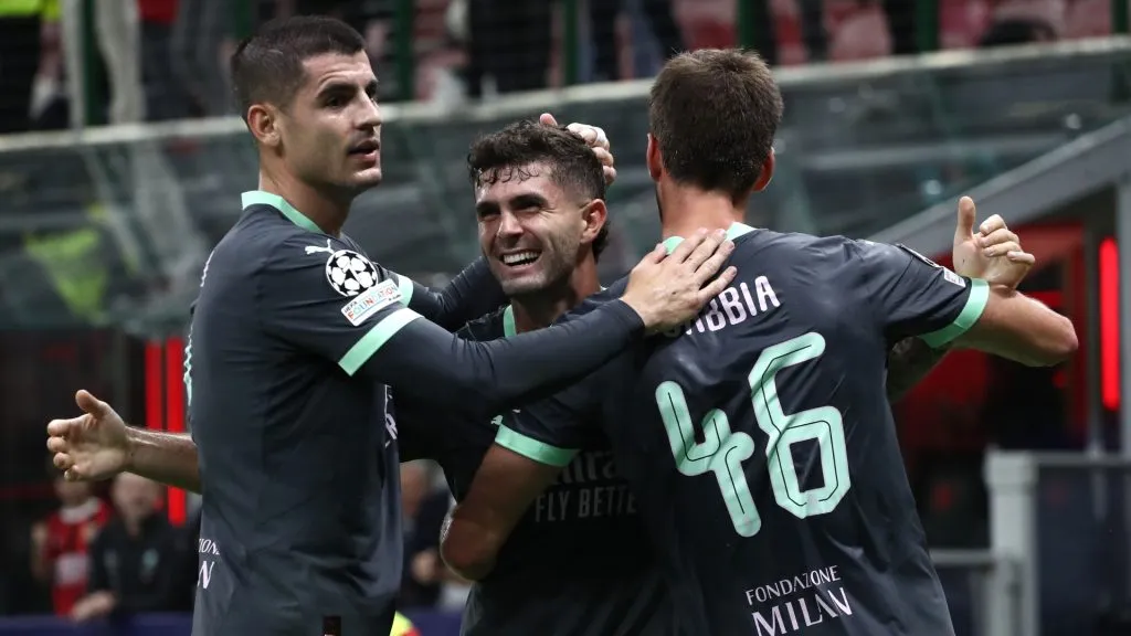 Christian Pulisic of AC Milan celebrates after scoring the opening goal with his team-mates Alvaro Morata and Matteo Gabbia during the UEFA Champions League 2024/25 League Phase MD3 match between AC Milan and Club Brugge KV at Stadio San Siro on October 22, 2024 in Milan, Italy. 