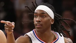 Terance Mann #14 of the LA Clippers reacts to a three-point shot over Devin Booker #1 of the Phoenix Suns during the first half of the NBA game at Footprint Center on April 09, 2024 in Phoenix, Arizona.
