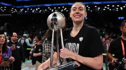 Breanna Stewart #30 of the New York Liberty celebrates with the WNBA Championship Trophy after winning Game Five of the WNBA Finals at Barclays Center on October 20, 2024 in New York City. (Photo by Elsa/Getty Images)