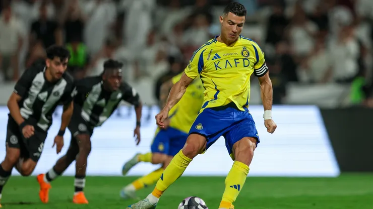 Cristiano Ronaldo of Al Nassr scoring the 2nd goal during the Saudi Pro League match between Al Shabab v Al Nassr FC at Al-Shabab Club Stadium on October 18, 2024 in Riyadh, Saudi Arabia. (Photo by Yasser Bakhsh/Getty Images)