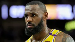 LeBron James #23 of the Los Angeles Lakers walks on the court during a break in the third quarter of a preseason game against the Golden State Warriors at T-Mobile Arena at T-Mobile Arena on October 15, 2024 in Las Vegas, Nevada. The Warriors defeated the Lakers 111-97.