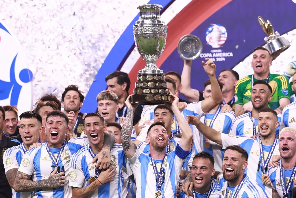 Lionel Messi of Argentina lifts the trophy after the CONMEBOL Copa America 2024 Final match between Argentina and Colombia. Carmen Mandato/Getty Images