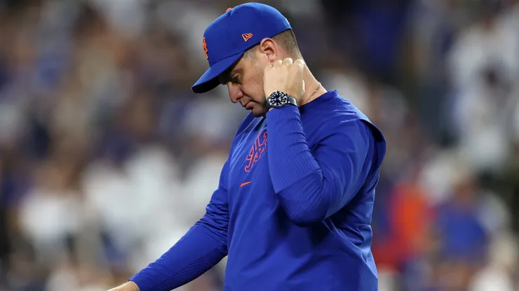 Manager Carlos Mendoza #64 of the New York Mets reacts as he walks back to the dugout after pulling pitcher Ryne Stanek #55 during the 6th inning of Game Six of the National League Championship Series against the Los Angeles Dodgers at Dodger Stadium on October 20, 2024 in Los Angeles, California.