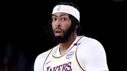 Anthony Davis #3 of the Los Angeles Lakers reacts after a three-point basket during the first quarter against the Phoenix Suns at Acrisure Arena on October 06, 2024 in Palm Springs, California.