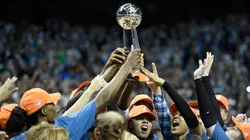 Minnesota Lynx raise the Championship trophy after defeating the Los Angeles Sparks in Game Five of the WNBA Finals on October 4, 2017