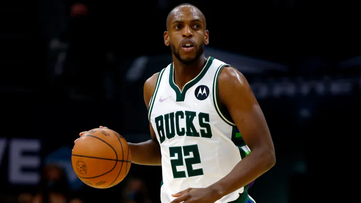 Khris Middleton #22 of the Milwaukee Bucks brings the ball up court during the first half of the game against the Charlotte Hornets