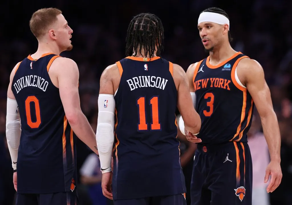 Donte DiVincenzo #0, Jalen Brunson #11 and Josh Hart #3 of the New York Knicks celebrate their win against the Indiana Pacers in Game Two. Elsa/Getty Images