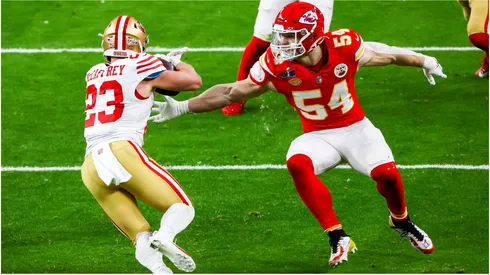 Kansas City Chiefs linebacker Leo Chenal attempts to maneuver toward San Francisco 49ers running back Christian McCaffrey