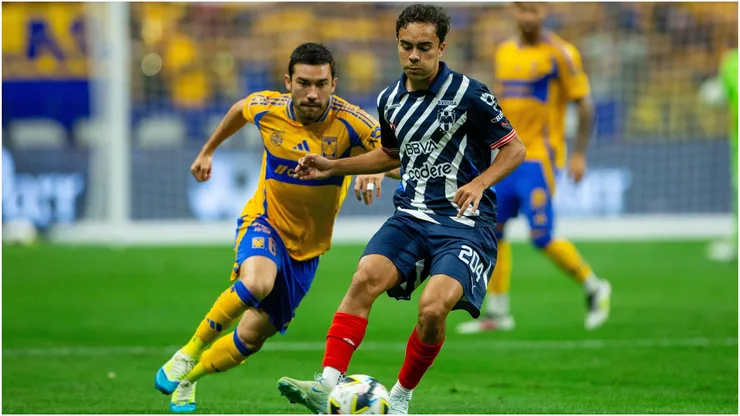Juan Pablo Vigon (L) of Tigres fights for the ball with Iker Fimbres (R) of Monterrey