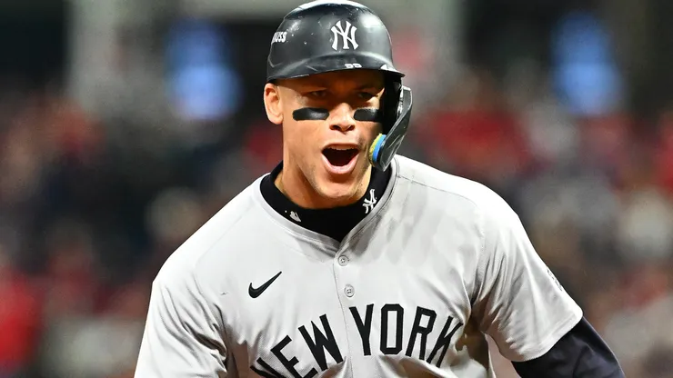: Aaron Judge #99 of the New York Yankees reacts after Giancarlo Stanton #27 hit a three-run home run in the sixth inning during Game Four of the American League Championship Series at Progressive Field on October 18, 2024 in Cleveland, Ohio.