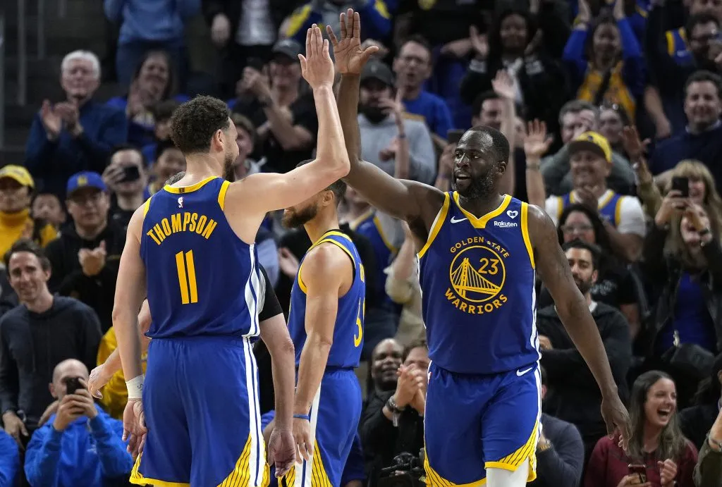 Draymond Green #23 of the Golden State Warriors celebrates with Klay Thompson #11 after scoring against the Dallas Mavericks, Thearon W. Henderson/Getty Images