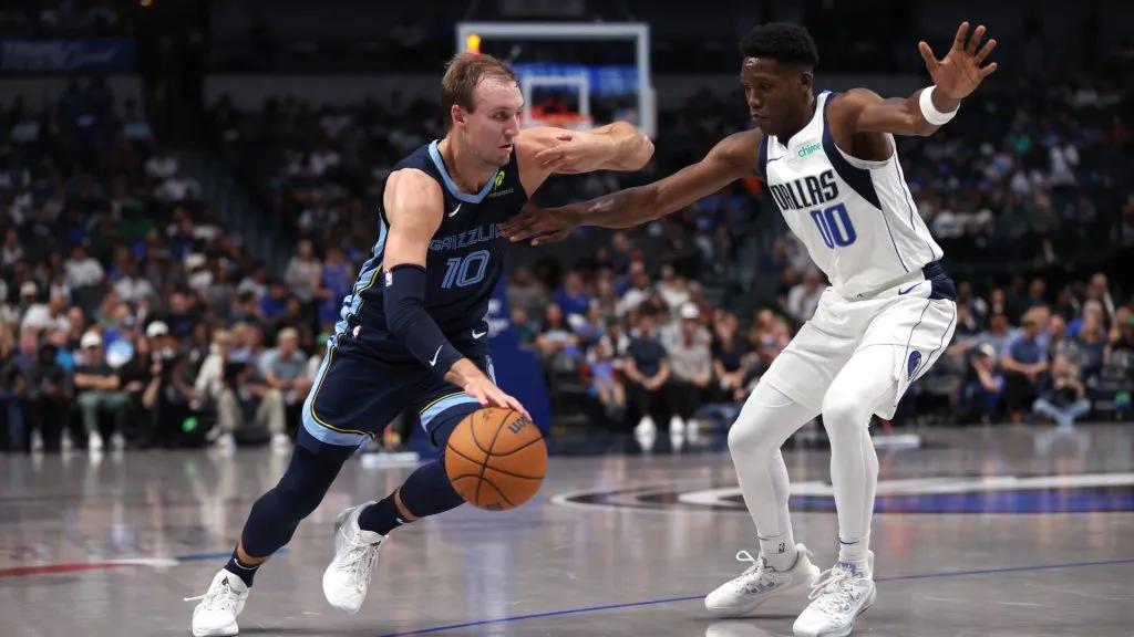 Luke Kennard #10 of the Memphis Grizzlies drives against Jazian Gortman #00 of the Dallas Mavericks in the second half of a preseason game at American Airlines Center on October 7, 2024 in Dallas, Texas. (Photo by Ron Jenkins/Getty Images)