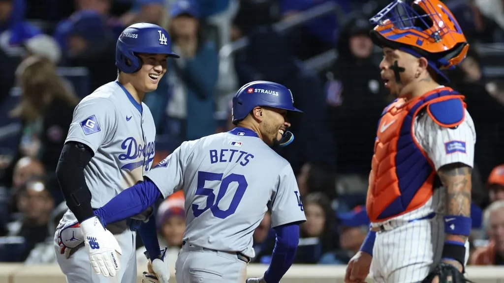 Mookie Betts #50 of the Los Angeles Dodgers celebrates a two run home run with Shohei Ohtani #17 of the Los Angeles Dodgers as Francisco Alvarez #4 of the New York Mets reacts during the sixth inning during Game Four of the National League Championship Series at Citi Field on October 17, 2024 in New York City. (Photo by Sarah Stier/Getty Images)
