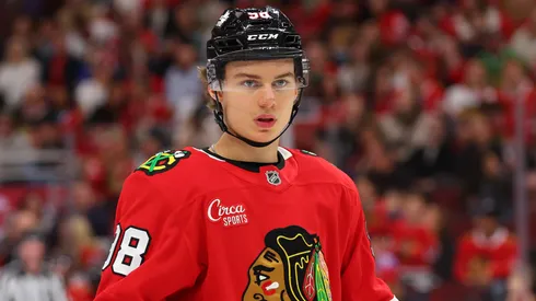 Connor Bedard #98 of the Chicago Blackhawks looks on against the Minnesota Wild during the second period of a preseason game at the United Center on October 04, 2024 in Chicago, Illinois.