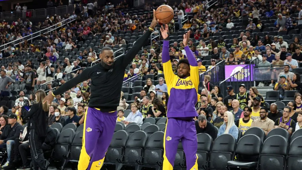 LeBron James (L) #23 and Bronny James #9 of the Los Angeles Lakers warm up before a preseason game against the Golden State Warriors at T-Mobile Arena at T-Mobile Arena on October 15, 2024 in Las Vegas, Nevada. (Photo by Ethan Miller/Getty Images)