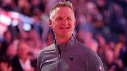 Golden State Warriors head coach Steve Kerr stands for the national anthem before their preseason game against the Sacramento Kings