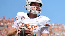 Quinn Ewers #3 of the Texas Longhorns warms up prior to a game against the Oklahoma Sooners at Cotton Bowl Stadium on October 12, 2024 in Dallas, Texas.