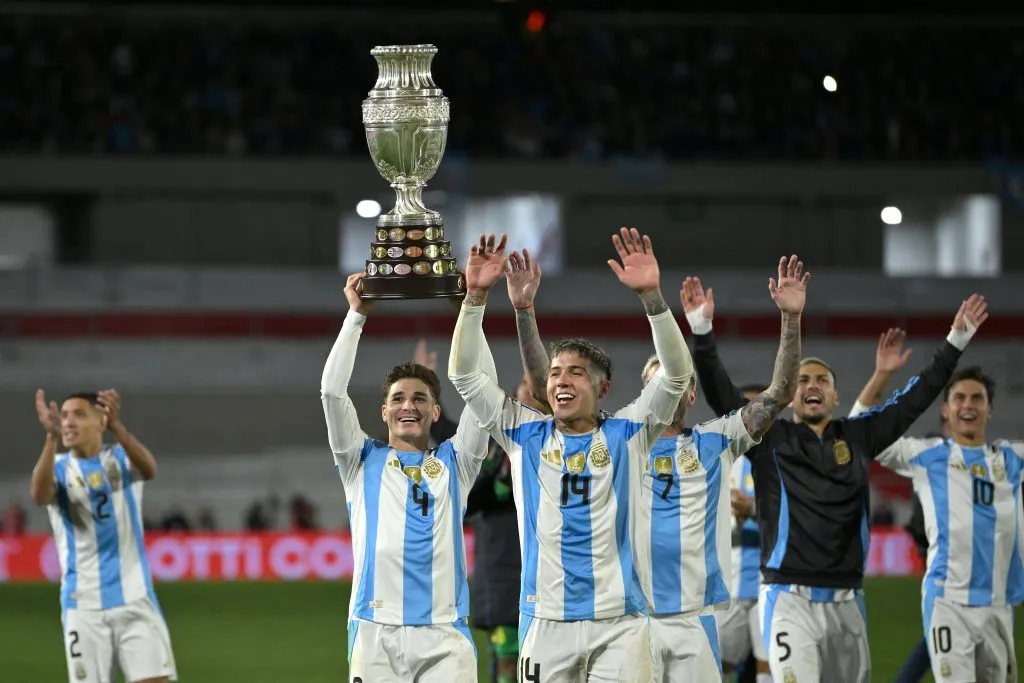 Julian Alvarez of Argentina and teammates celebrate with the Copa America 2024 trophy after the FIFA World Cup 2026 Qualifier match between Argentina and Chile. Marcelo Endelli/Getty Images