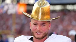 Quinn Ewers #3 of the Texas Longhorns wears the Golden Hat Trophy after defeating the Oklahoma Sooners 34-3 at Cotton Bowl Stadium on October 12, 2024 in Dallas, Texas.