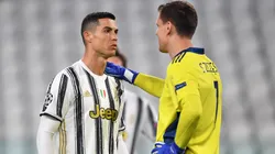Cristiano Ronaldo of Juventus interacts with Wojciech Szczesny of Juventus during the UEFA Champions League Round of 16 match between Juventus and FC Porto at Juventus Arena on March 09, 2021 in Turin, Italy. Sporting stadiums around Italy remain under strict restrictions due to the Coronavirus Pandemic as Government social distancing laws prohibit fans inside venues resulting in games being played behind closed doors. (Photo by Valerio Pennicino/Getty Images)