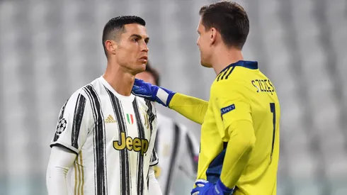 Cristiano Ronaldo of Juventus interacts with Wojciech Szczesny of Juventus during the UEFA Champions League Round of 16 match between Juventus and FC Porto at Juventus Arena on March 09, 2021 in Turin, Italy. Sporting stadiums around Italy remain under strict restrictions due to the Coronavirus Pandemic as Government social distancing laws prohibit fans inside venues resulting in games being played behind closed doors. (Photo by Valerio Pennicino/Getty Images)