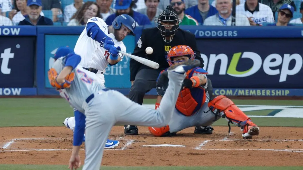 Max Muncy #13 of the Los Angeles Dodgers hits a single off Kodai Senga #34 of the New York Mets in the first inning during Game One of the Championship Series at Dodger Stadium on October 13, 2024 in Los Angeles, California. (Photo by Kevork Djansezian/Getty Images)