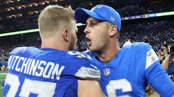 Jared Goff #16 and Aidan Hutchinson #97 of the Detroit Lions celebrate defeating the Los Angeles Rams 26-20 in overtime at Ford Field on September 08, 2024 in Detroit, Michigan.