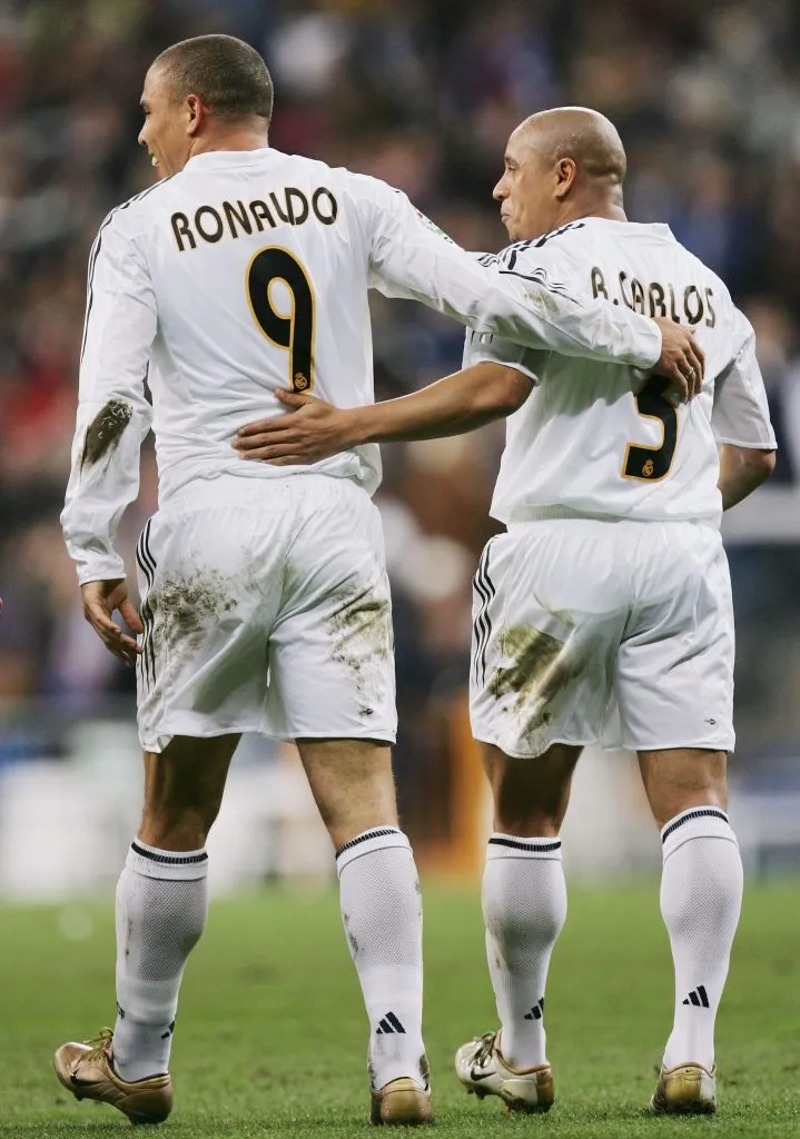 MADRID, SPAIN ā DECEMBER 12: Ronaldo of Real Madrid celebrates with Roberto Carlos after scoring a goal against Real Sociedad. Denis Doyle/Getty Images