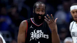 James Harden #1 of the LA Clippers reacts between Daniel Gafford #21 and Kyrie Irving #11 of the Dallas Mavericks during the first half at Crypto.com Arena on April 23, 2024 in Los Angeles, California.