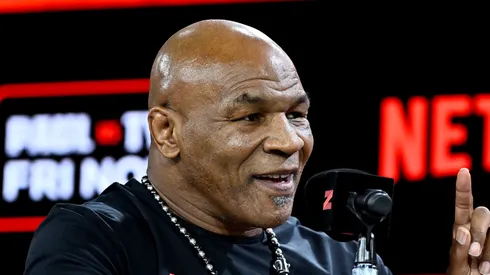 Mike Tyson (L) and Jake Paul face off at an exclusive press conference ahead of their November bout during the Fanatics Fest NYC 2024 at Jacob Javits Center on August 18, 2024 in New York City.