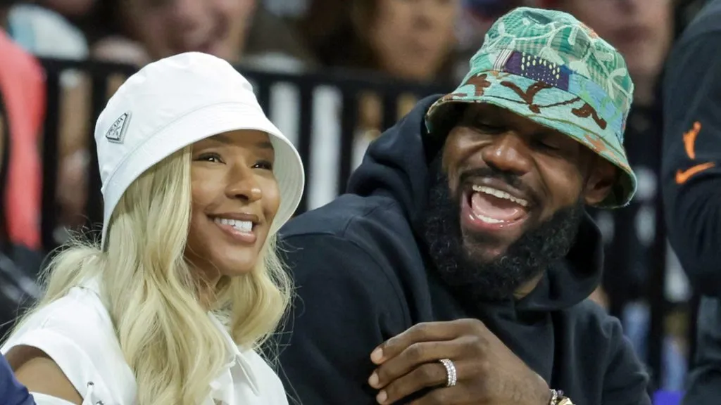 Savannah James (L) and NBA player LeBron James of the Los Angeles Lakers attend a game between the New York Liberty and the Las Vegas Aces at Michelob ULTRA Arena on June 15, 2024 in Las Vegas, Nevada. The Liberty defeated the Aces 90-82.