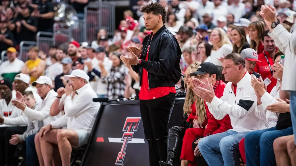Quarterback Patrick Mahomes of the Kansas City Chiefs claps during the first half of the college basketball game between the Texas Tech Red Raiders and the Baylor Bears at United Supermarkets Arena on February 16, 2022 in Lubbock, Texas.