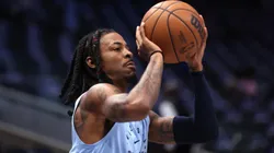 Ja Morant #12 of the Memphis Grizzlies warms up prior to a pre-season game against the Dallas Mavericks at American Airlines Center on October 7, 2024 in Dallas, Texas.