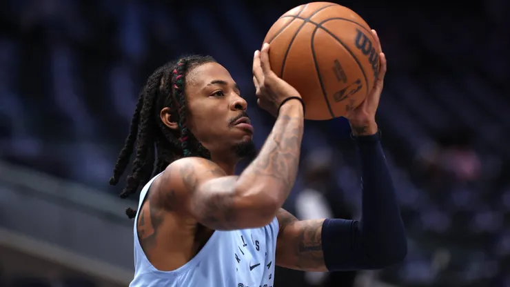 Ja Morant #12 of the Memphis Grizzlies warms up prior to a pre-season game against the Dallas Mavericks at American Airlines Center on October 7, 2024 in Dallas, Texas.