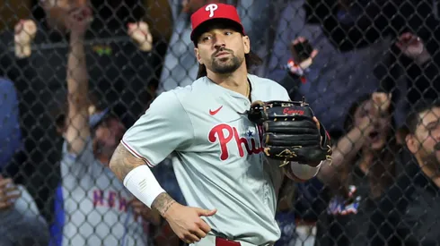 Fans cheer as Nick Castellanos #8 of the Philadelphia Phillies can't catch a solo home run by Jesse Winker #3 of the New York Mets in the fourth inning during Game Three of the Division Series at Citi Field on October 08, 2024 in New York City.