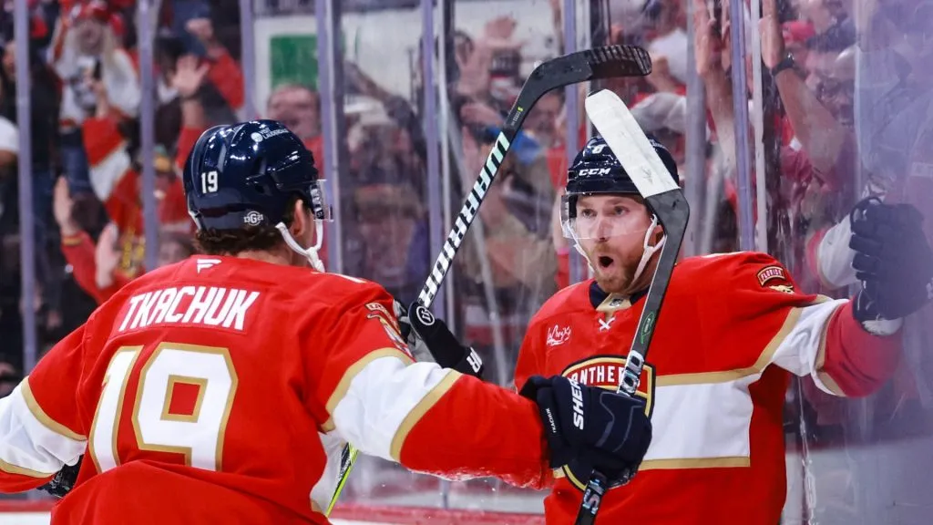 Sam Bennett #9 of the Florida Panthers reacts with Matthew Tkachuk #19 after scoring a goal during the first period against the Boston Bruins. at Amerant Bank Arena on October 08, 2024 in Sunrise, Florida.
