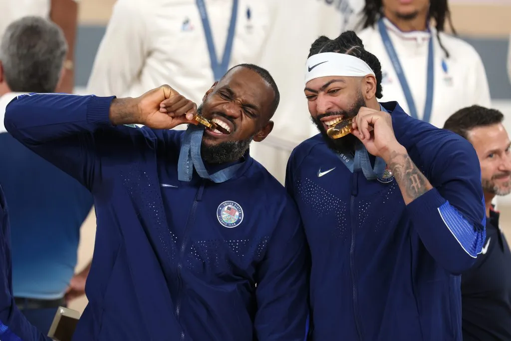 Gold medalists LeBron James and Anthony Davis of Team United States bite their medals while posing for a photo. Jamie Squire/Getty Images