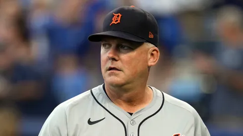 Manager A.J. Hinch #14 of the Detroit Tigers walks back to the dugout after delivering the starting lineup prior to a game against the Kansas City Royals at Kauffman Stadium on September 16, 2024 in Kansas City, Missouri.
