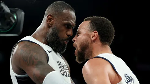 LeBron James #6 and Stephen Curry #4 of Team United States celebrate after their team's win against Team Serbia during a Men's basketball semifinals match between Team United States and Team Serbia on day thirteen of the Olympic Games Paris 2024 at Bercy Arena on August 08, 2024 in Paris, France.