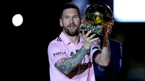 Lionel Messi #10 of Inter Miami CF hoist his trophy during the Ballon d'Or trophy presentation at DRV PNK Stadium on November 10, 2023 in Fort Lauderdale, Florida. (Photo by Megan Briggs/Getty Images)