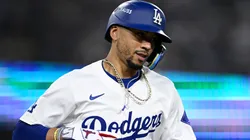 Mookie Betts #50 of the Los Angeles Dodgers walks to first base during the eighth inning against the San Diego Padres in Game One of the Division Series at Dodger Stadium on October 05, 2024 in Los Angeles, California.