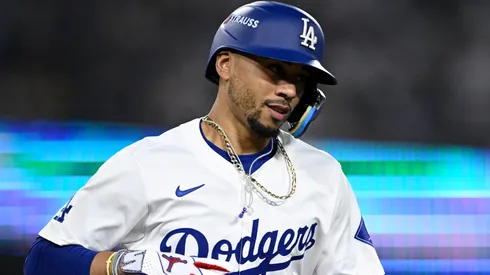 Mookie Betts #50 of the Los Angeles Dodgers walks to first base during the eighth inning against the San Diego Padres in Game One of the Division Series at Dodger Stadium on October 05, 2024 in Los Angeles, California.